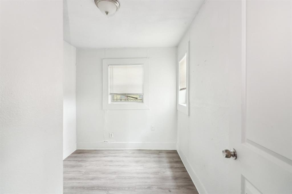 1906 Grainger Street Fort Worth, TX 76110 - Photo 14 of 38 Spare room featuring light wood-type flooring