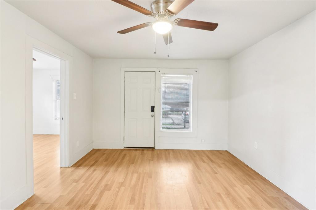 1906 Grainger Street Fort Worth, TX 76110 - Photo 16 of 38 Unfurnished room featuring light wood-type flooring and ceiling fan