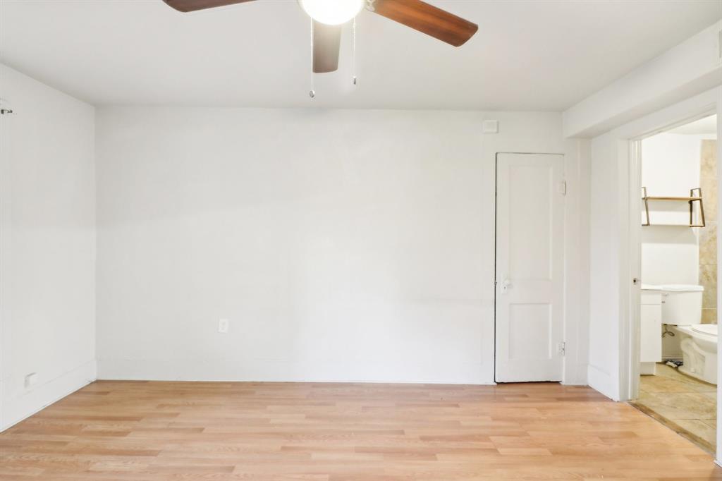 1906 Grainger Street Fort Worth, TX 76110 - Photo 19 of 38 Empty room with ceiling fan and light hardwood / wood-style floors
