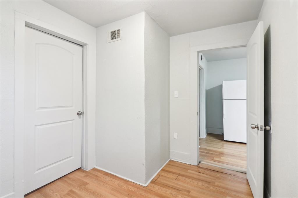 1906 Grainger Street Fort Worth, TX 76110 - Photo 23 of 38 Corridor featuring hardwood / wood-style flooring
