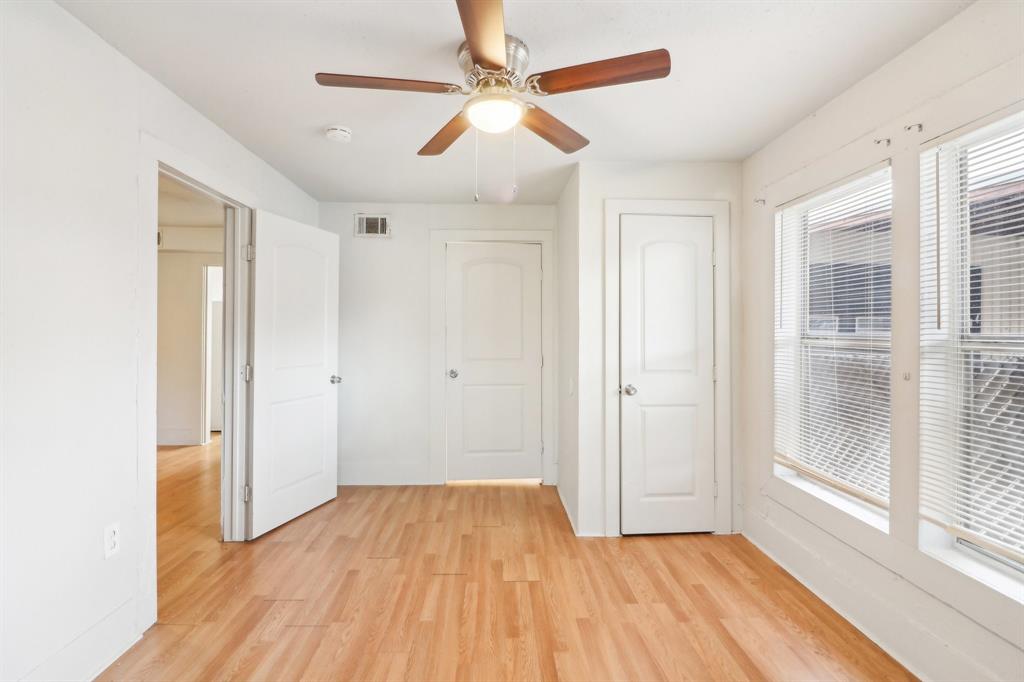 1906 Grainger Street Fort Worth, TX 76110 - Photo 25 of 38 Unfurnished bedroom with ceiling fan and light wood-type flooring
