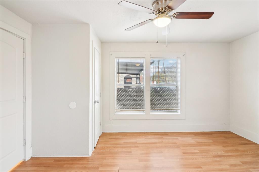 1906 Grainger Street Fort Worth, TX 76110 - Photo 26 of 38 Empty room featuring ceiling fan and light wood-type flooring