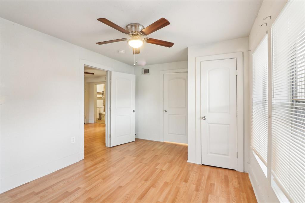 1906 Grainger Street Fort Worth, TX 76110 - Photo 28 of 38 Unfurnished bedroom featuring ceiling fan and light hardwood / wood-style flooring