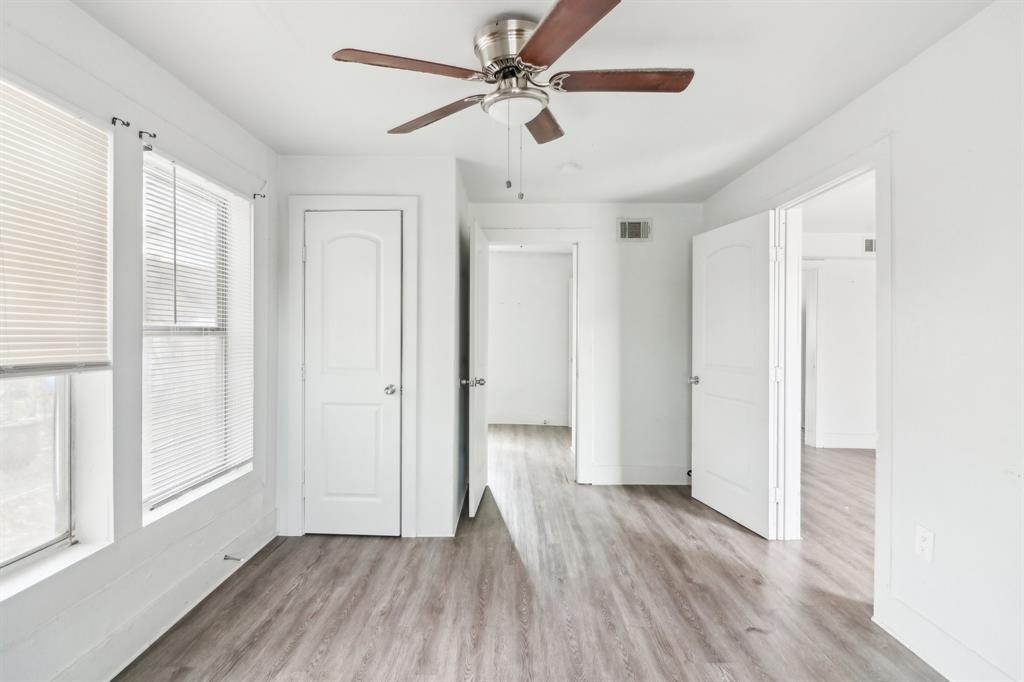 1906 Grainger Street Fort Worth, TX 76110 - Photo 9 of 38 Unfurnished bedroom featuring light hardwood / wood-style flooring and ceiling fan