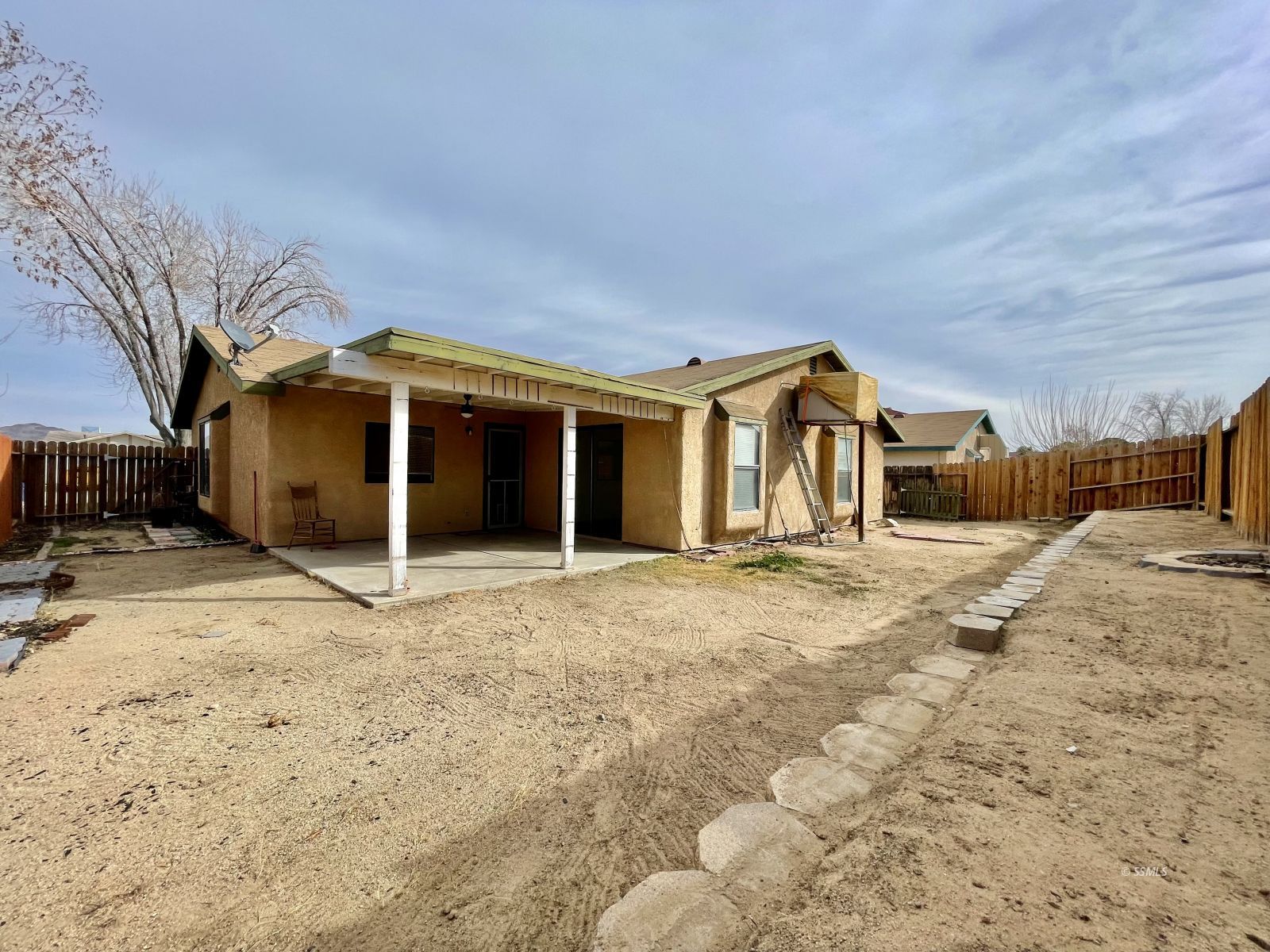 225 Michele Street Ridgecrest, CA 93555 - Photo 11 of 36 a view of a house with a yard and garage