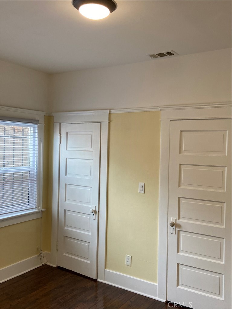 1331 Atlantic Avenue Long Beach, CA 90813 - Photo 25 of 44 a view of an empty room and wooden floor and closet