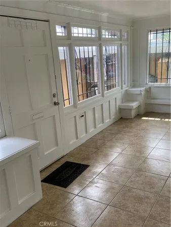 a view of entryway with stairs and a window