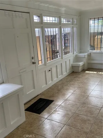 a view of entryway with stairs and a window