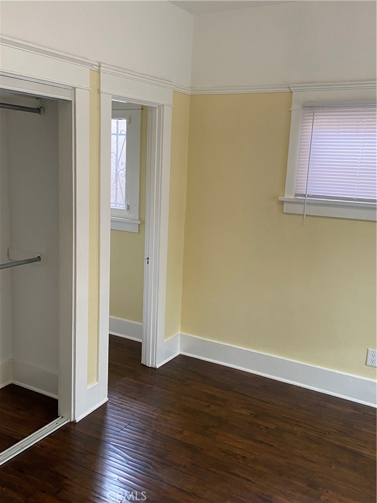 1331 Atlantic Avenue Long Beach, CA 90813 - Photo 29 of 44 an empty room with wooden floor