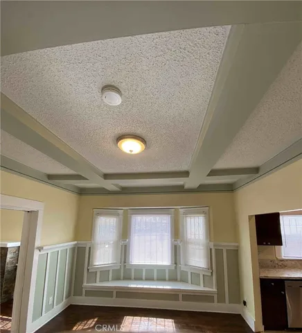 a view of livingroom with furniture and flat screen tv