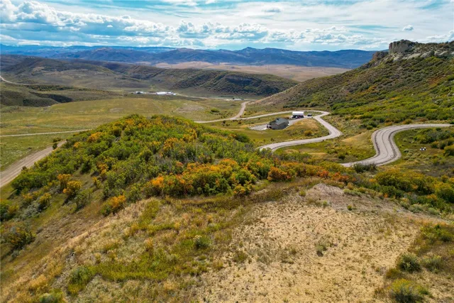 a view of an ocean and a mountain