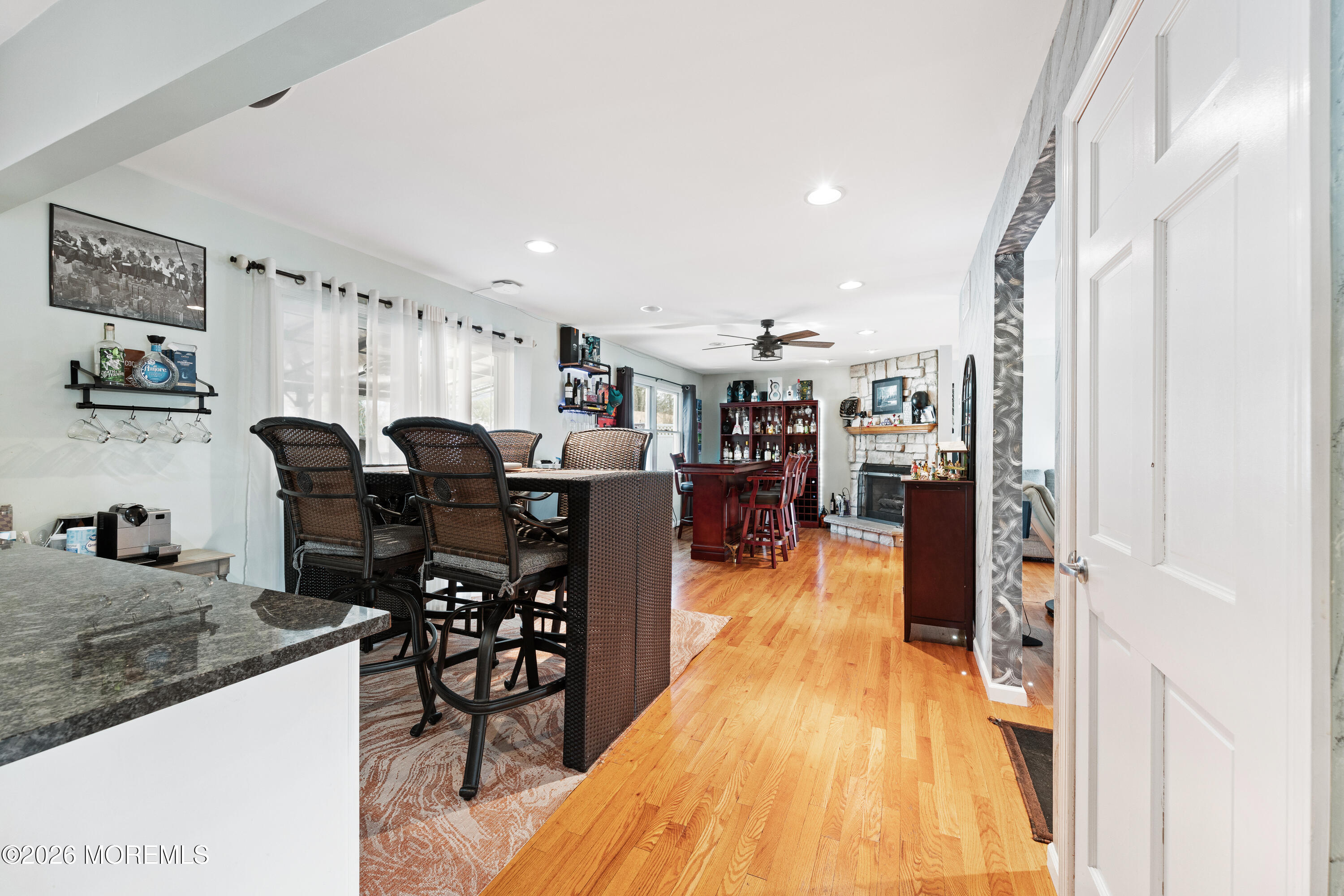 746 Rabbit Run Brick, NJ 08724 - Photo 13 of 41 a dining hall with stainless steel appliances granite countertop a table chairs and a refrigerator