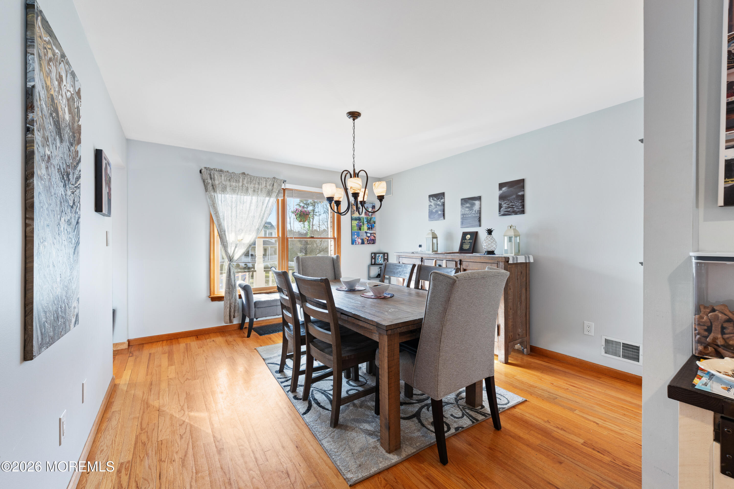 746 Rabbit Run Brick, NJ 08724 - Photo 16 of 41 a dining room with furniture and wooden floor