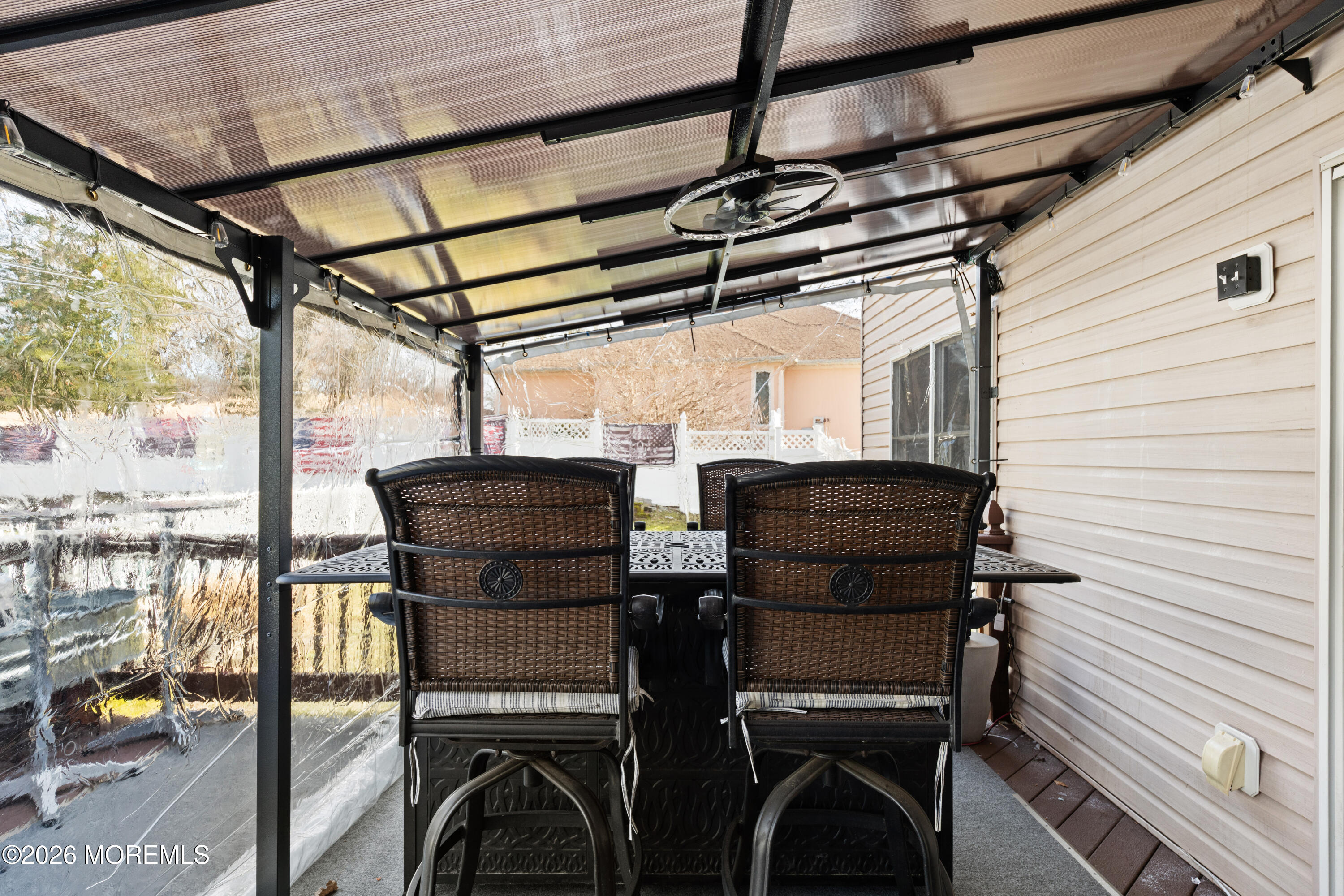 746 Rabbit Run Brick, NJ 08724 - Photo 18 of 41 a view of a chairs and table in the balcony