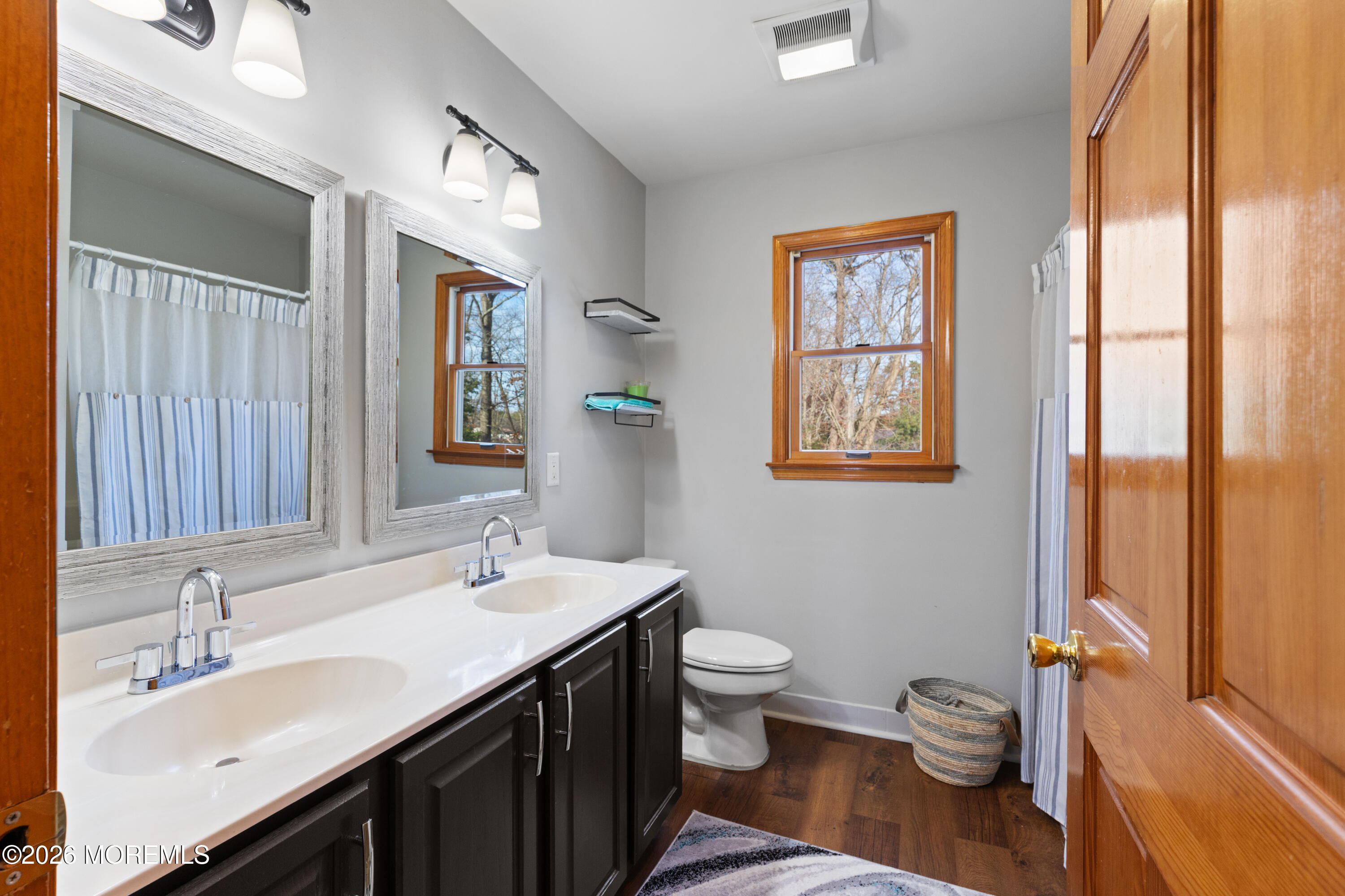 746 Rabbit Run Brick, NJ 08724 - Photo 20 of 41 a bathroom with a toilet sink and mirror