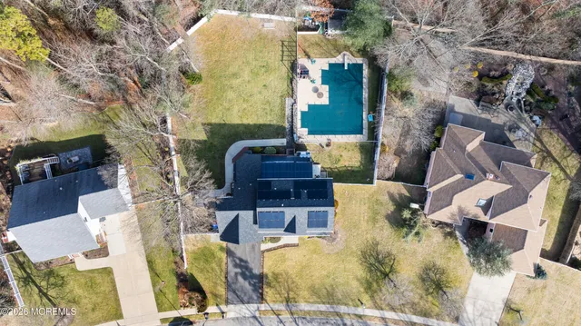 an aerial view of a house with outdoor space