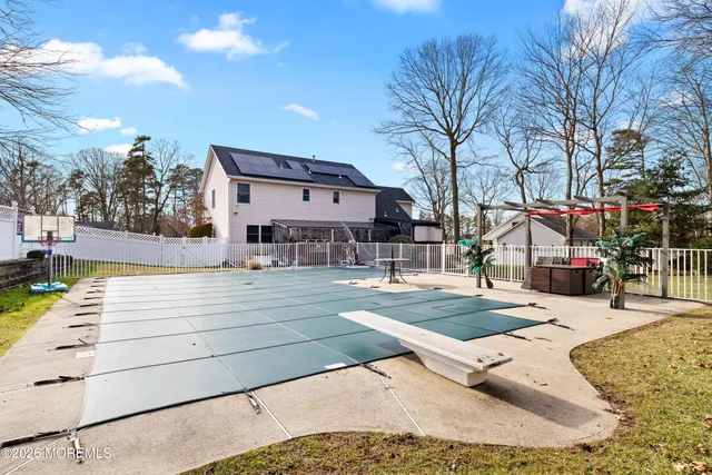 a view of a building with snow on the road