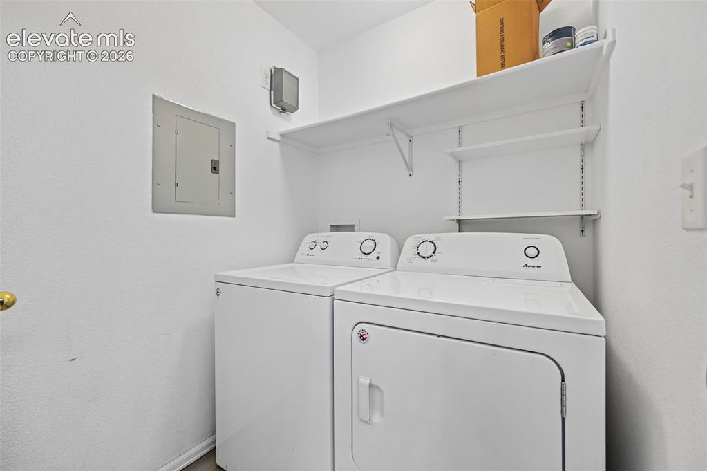 431 Kitfield View Colorado Springs, CO 80916 - Photo 16 of 27 a utility room with dryer and washer