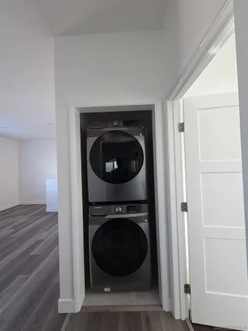 a view of a hallway with washer and dryer