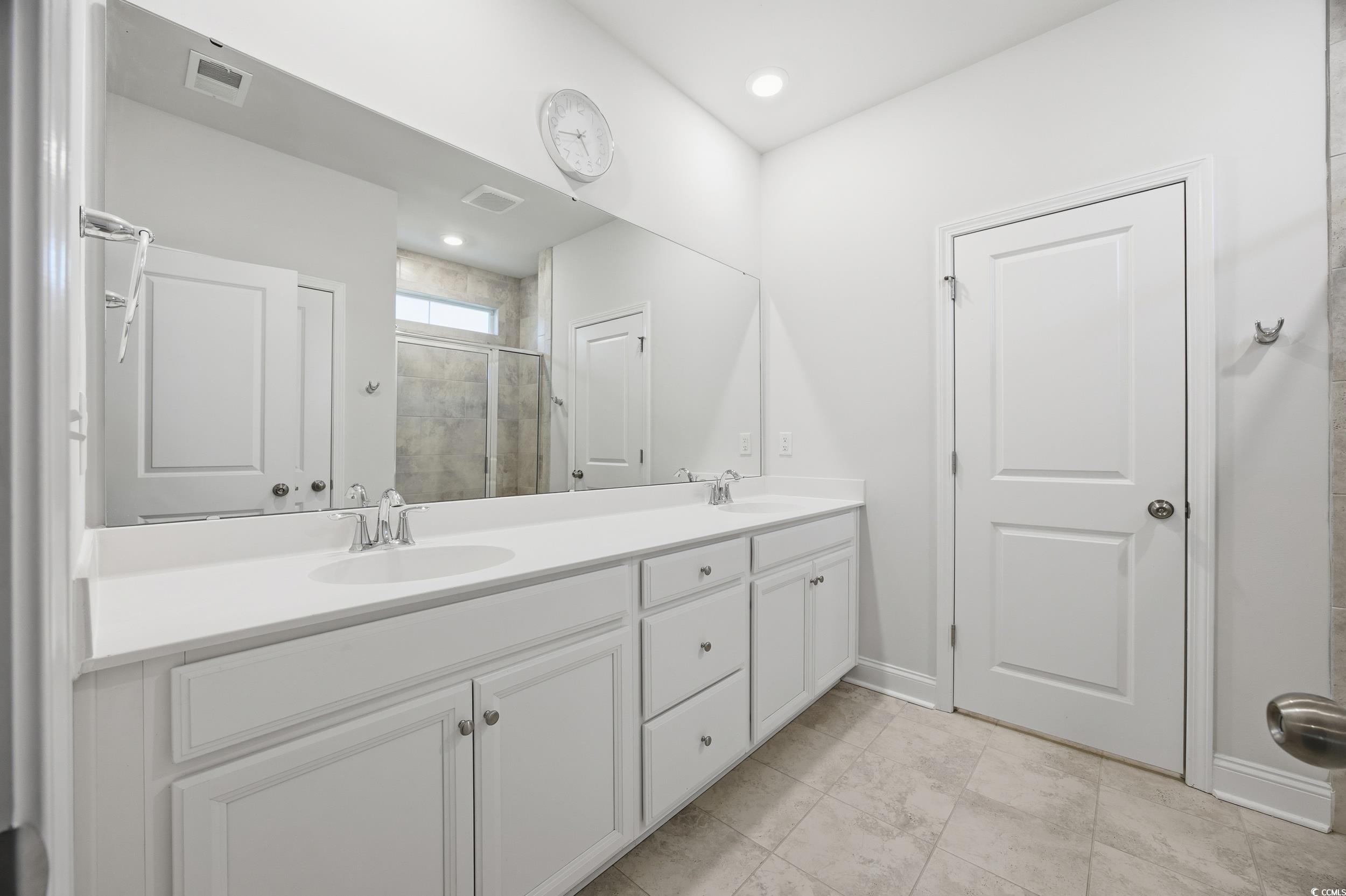 386 Harbison Circle Myrtle Beach, SC 29579 - Photo 20 of 34 Bathroom featuring a shower stall, double vanity, recessed lighting, and light tile patterned flooring