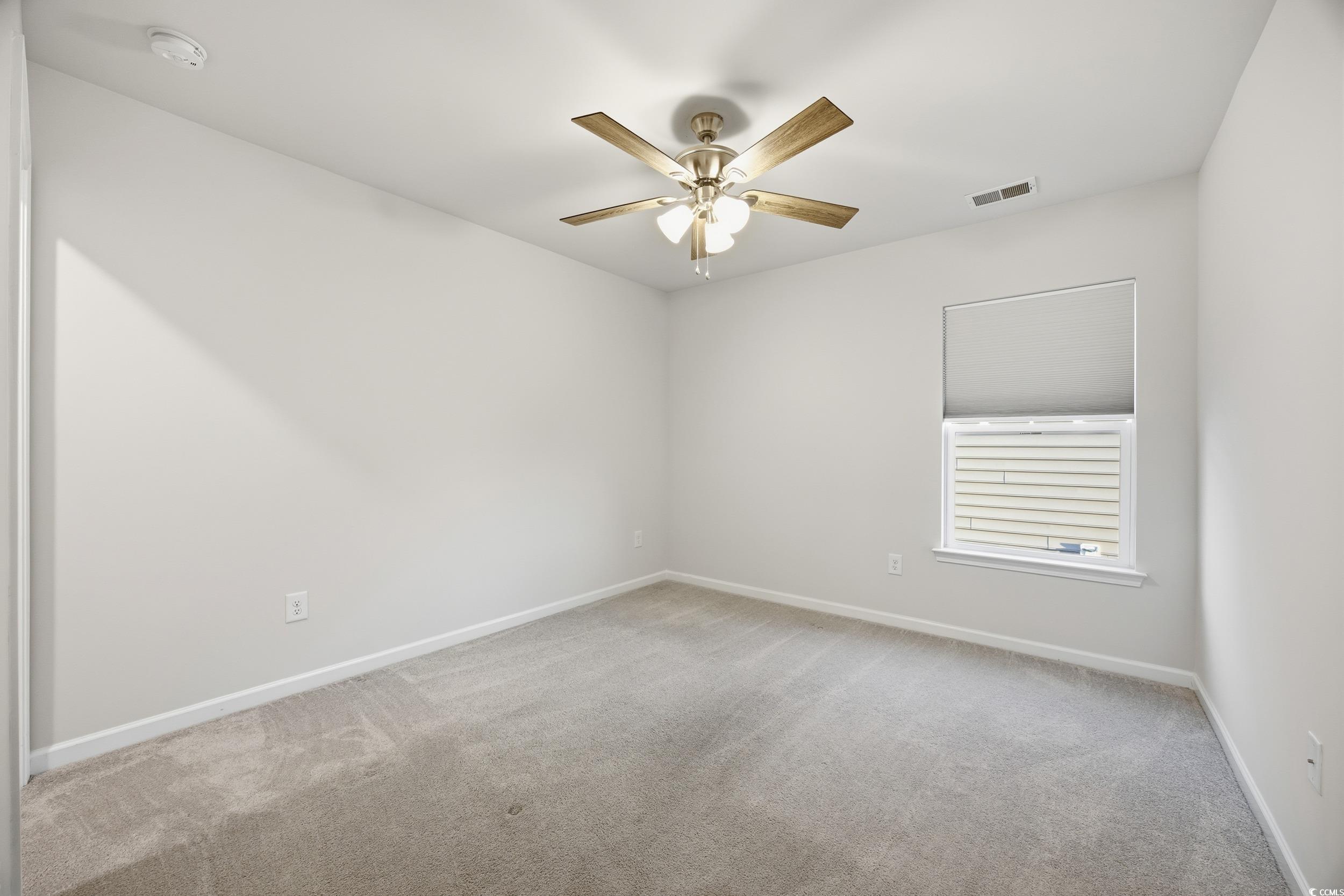 386 Harbison Circle Myrtle Beach, SC 29579 - Photo 22 of 34 Unfurnished room with light colored carpet and ceiling fan