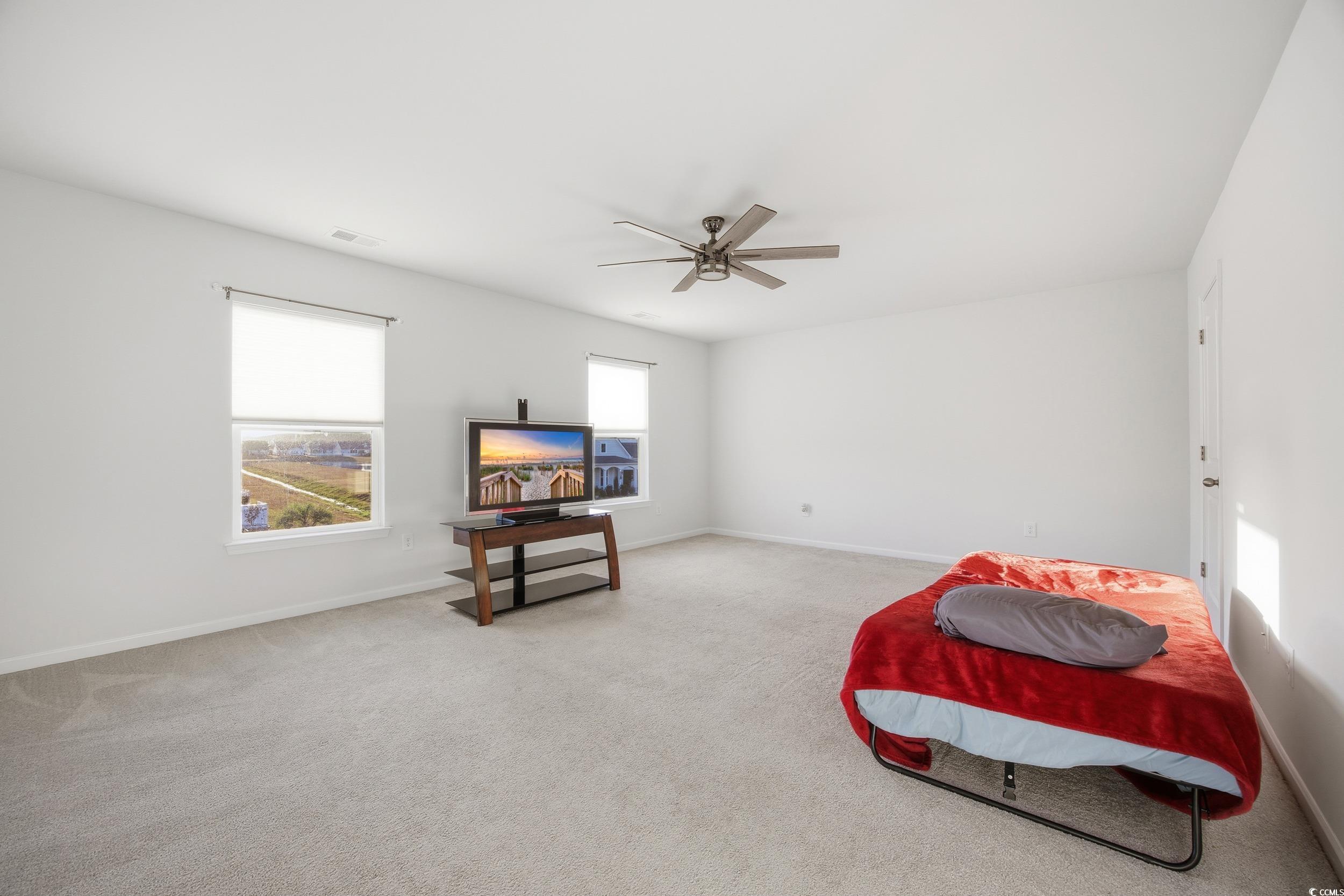 386 Harbison Circle Myrtle Beach, SC 29579 - Photo 27 of 34 Carpeted bedroom with baseboards and a ceiling fan