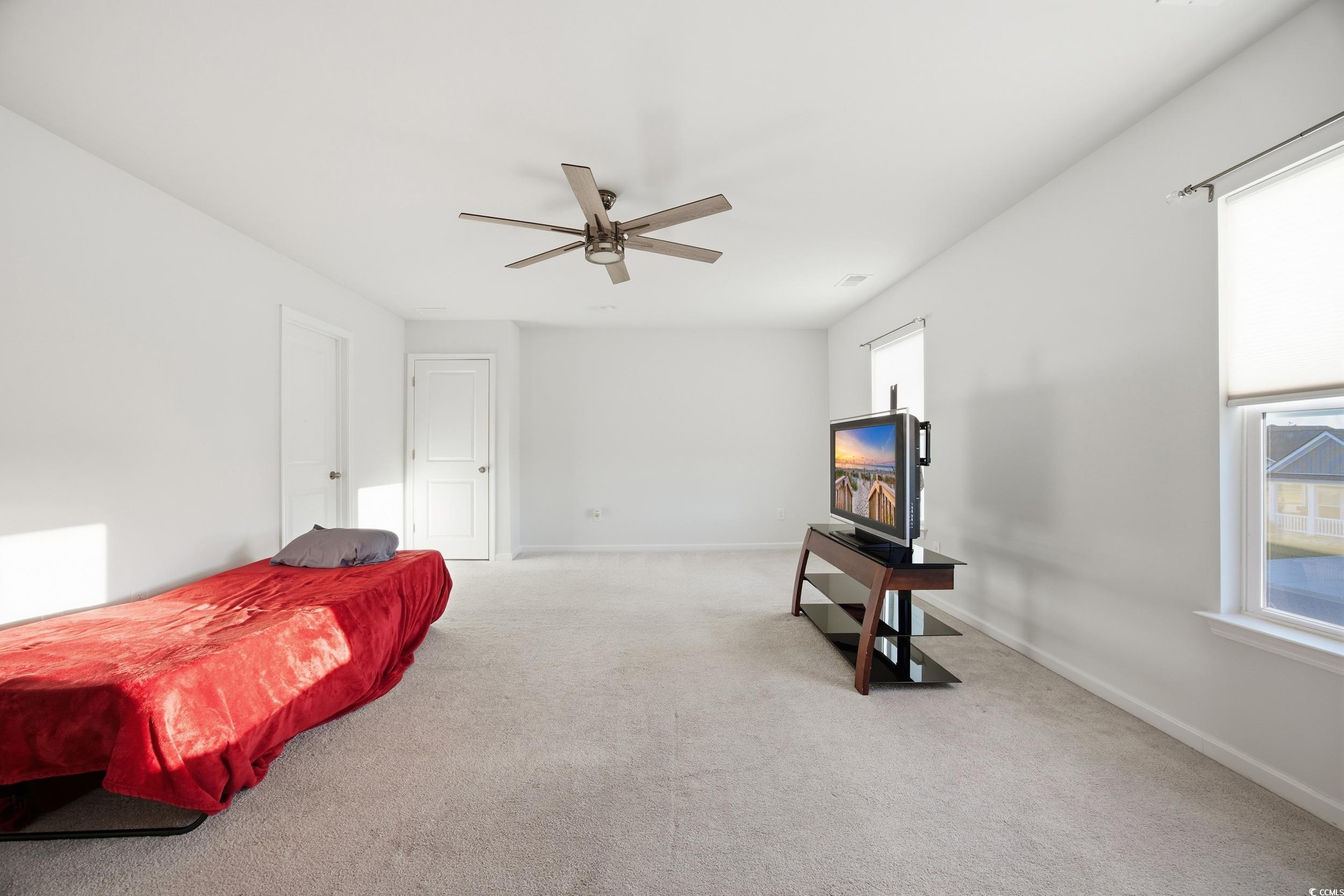 386 Harbison Circle Myrtle Beach, SC 29579 - Photo 28 of 34 Carpeted bedroom featuring ceiling fan and baseboards