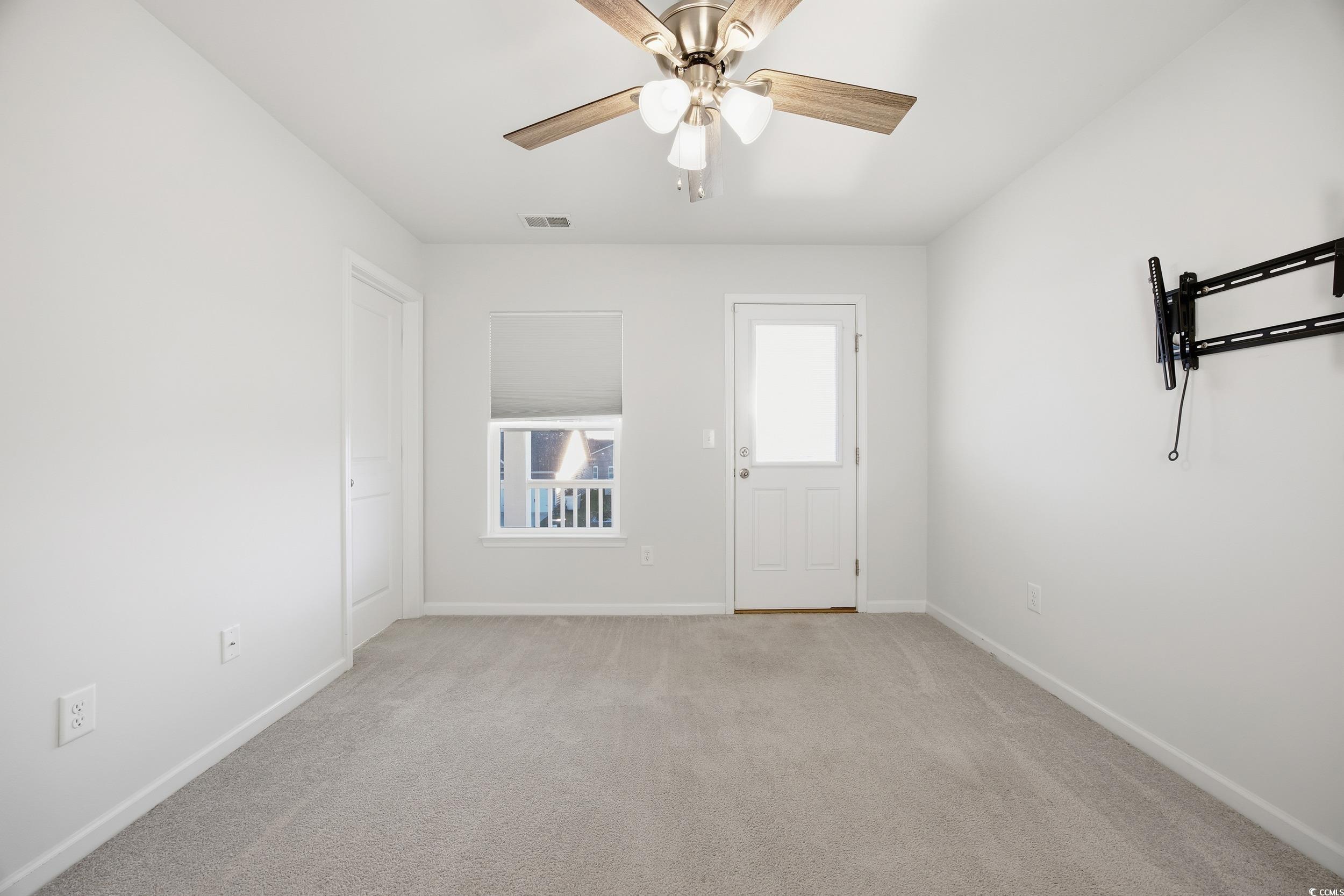 386 Harbison Circle Myrtle Beach, SC 29579 - Photo 29 of 34 Unfurnished room with light carpet and ceiling fan