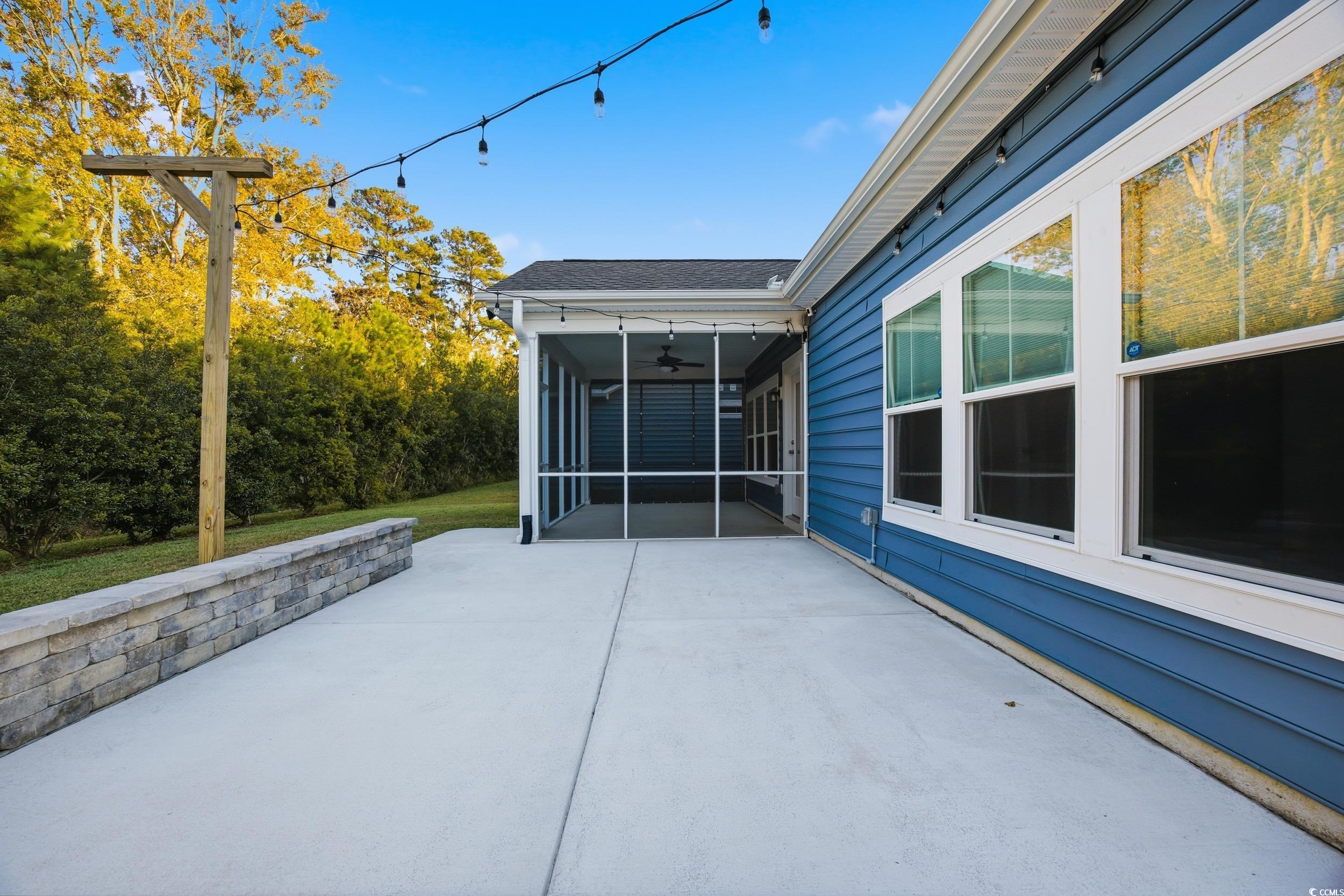 386 Harbison Circle Myrtle Beach, SC 29579 - Photo 32 of 34 View of patio / terrace with ceiling fan and a sunroom