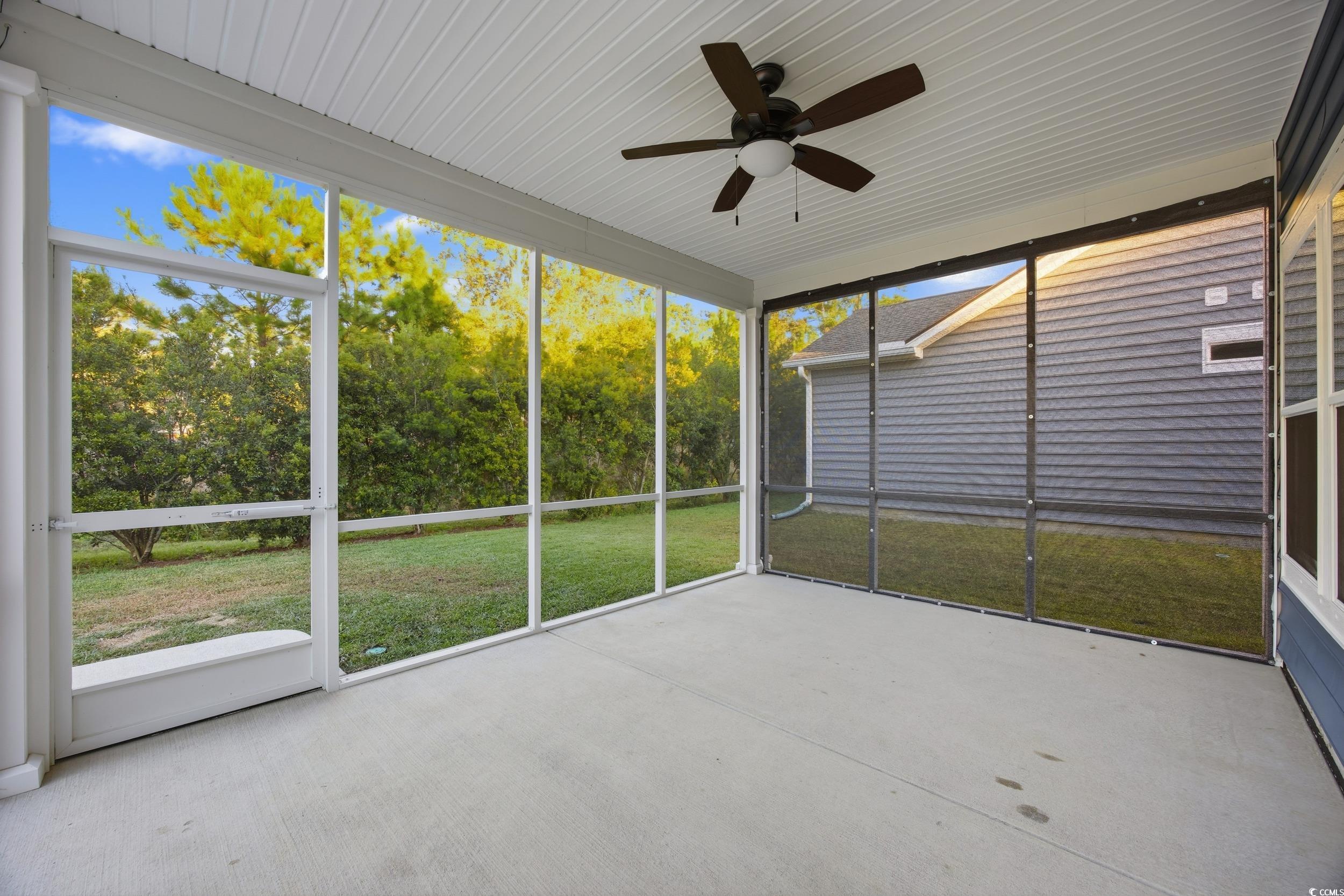 386 Harbison Circle Myrtle Beach, SC 29579 - Photo 32 of 40 Unfurnished sunroom featuring ceiling fan and view of wooded area