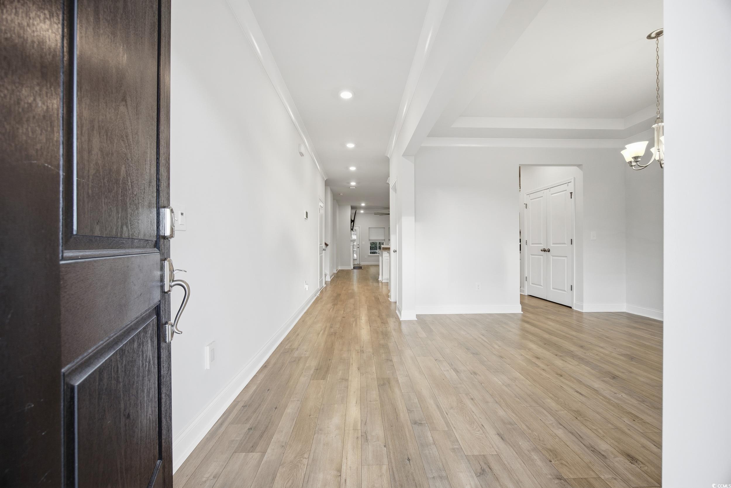 386 Harbison Circle Myrtle Beach, SC 29579 - Photo 4 of 34 Entryway featuring a chandelier, light wood finished floors, and recessed lighting