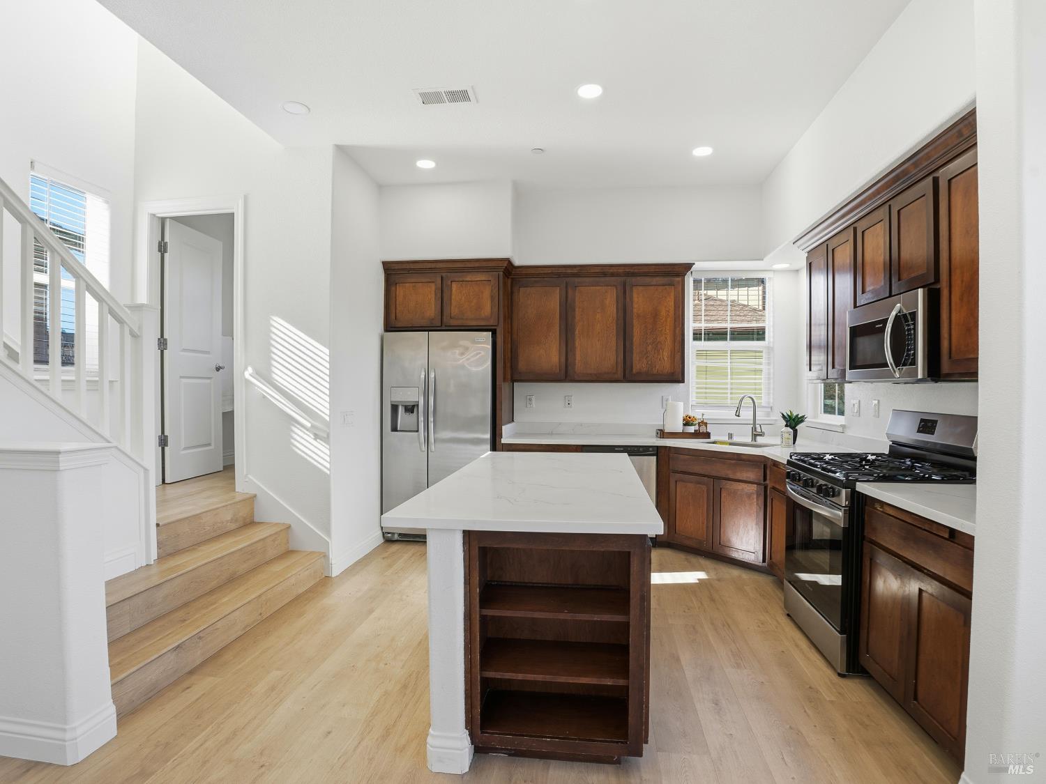 4424 Streamside Drive Santa Rosa, CA 95409 - Photo 12 of 55 a large kitchen with stainless steel appliances granite countertop a stove a sink and a refrigerator