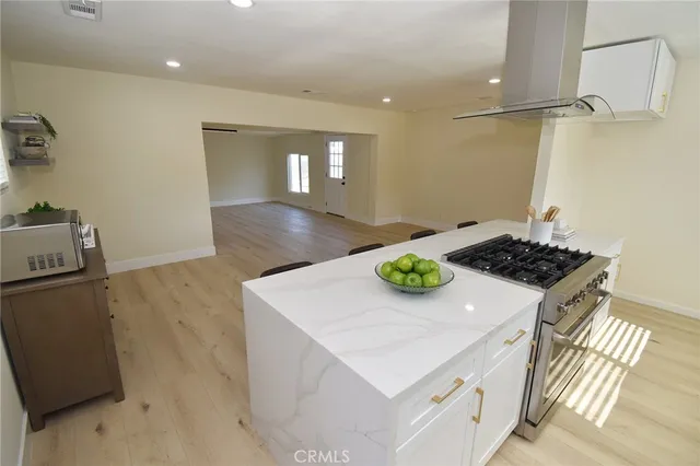 a kitchen that has a sink and a stove