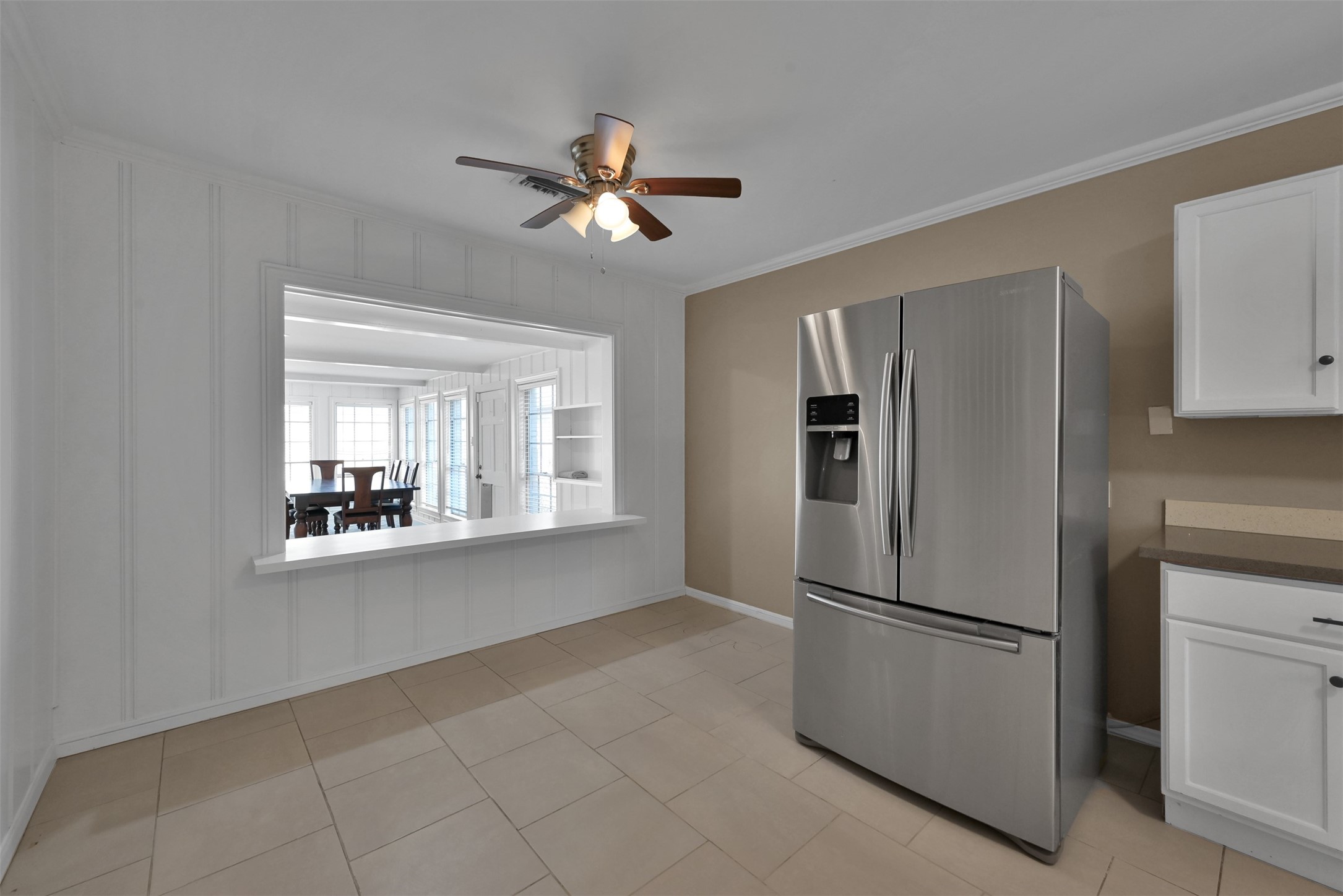416 Milwaukee Street Houston, TX 77009 - Photo 12 of 25 a metallic refrigerator freezer sitting in a kitchen
