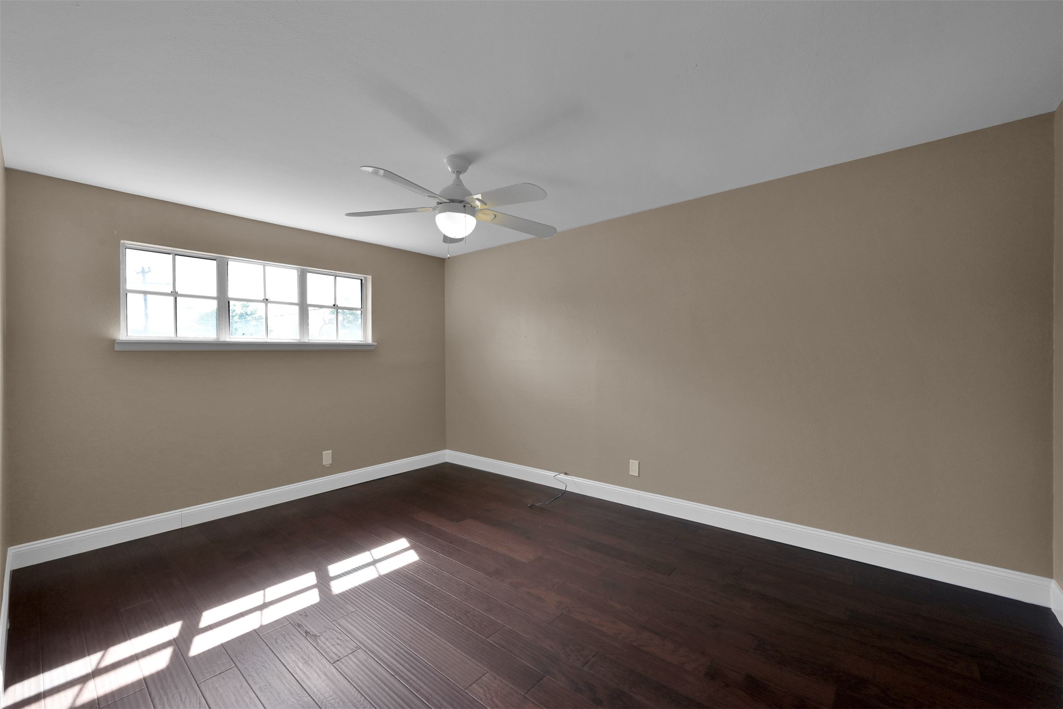 416 Milwaukee Street Houston, TX 77009 - Photo 19 of 25 a view of wooden floor and windows in a room