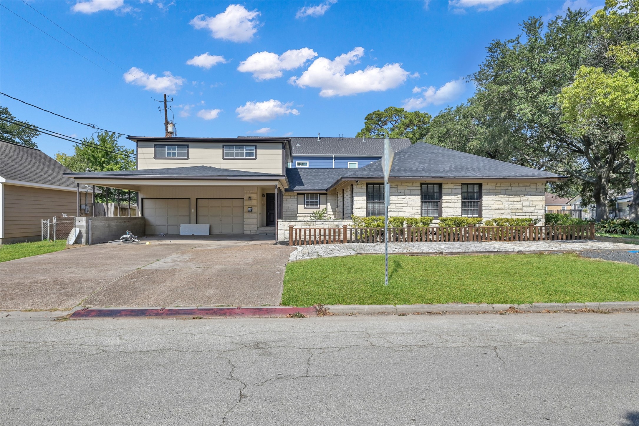 416 Milwaukee Street Houston, TX 77009 - Photo 2 of 25 a front view of a house with a garden and plants