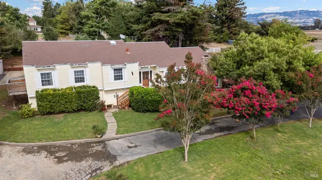 a view of a house with a garden