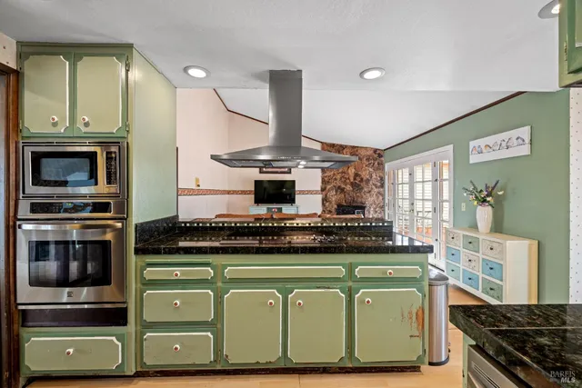 a kitchen with a stove and a refrigerator