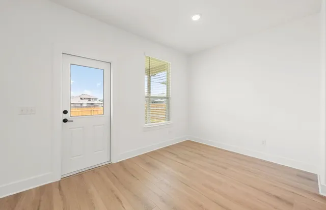 a kitchen with a sink and chandelier