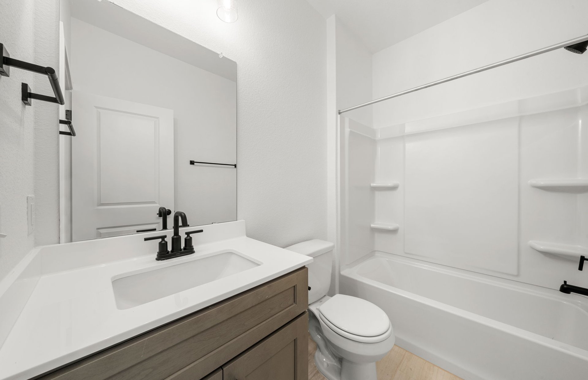 560 Tailwind Drive Kyle, TX 78640 - Photo 14 of 37 a bathroom with a sink a toilet and a bathtub