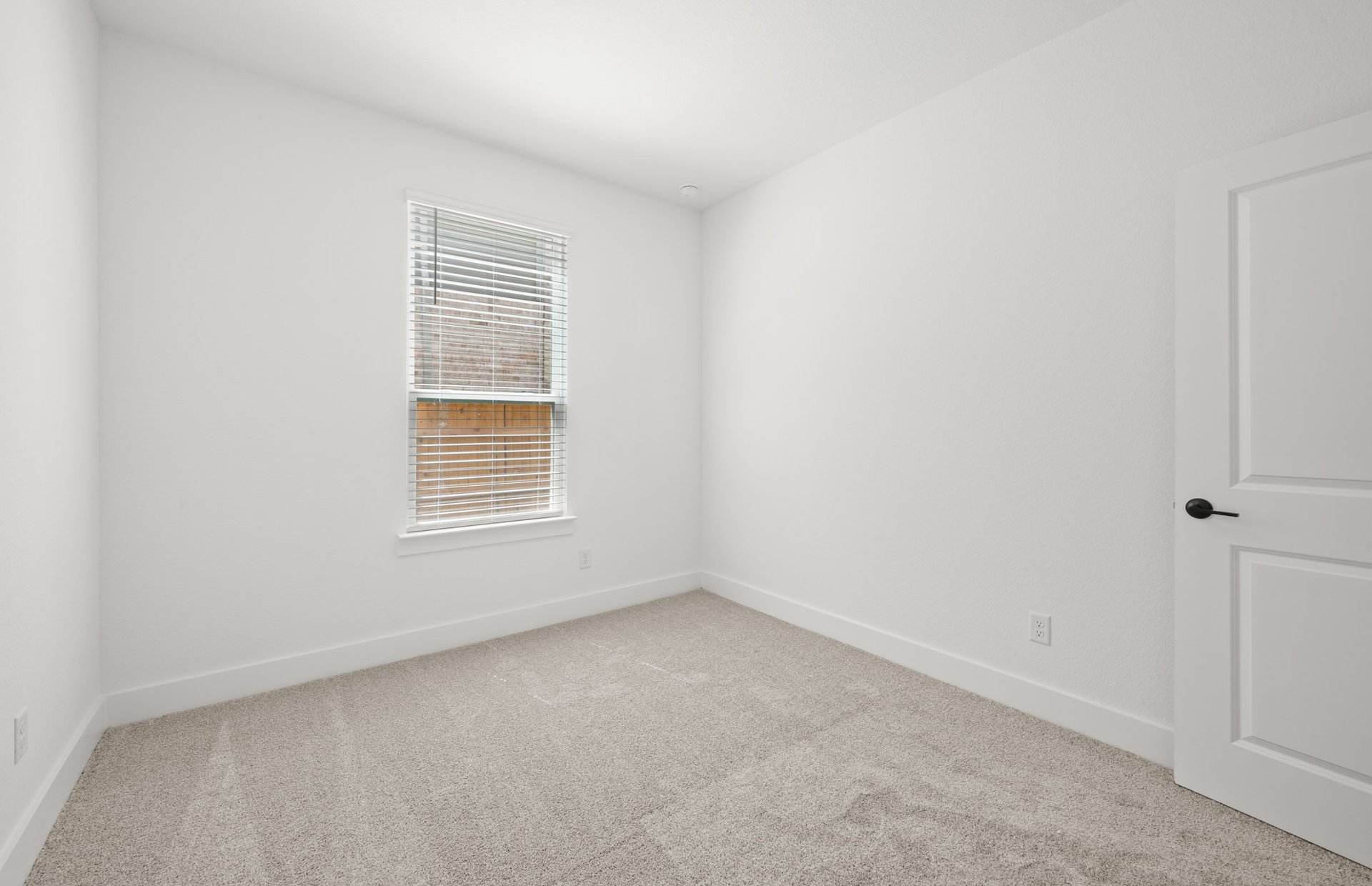 560 Tailwind Drive Kyle, TX 78640 - Photo 16 of 37 a view of an empty room with a window