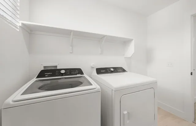 a utility room with dryer and washer