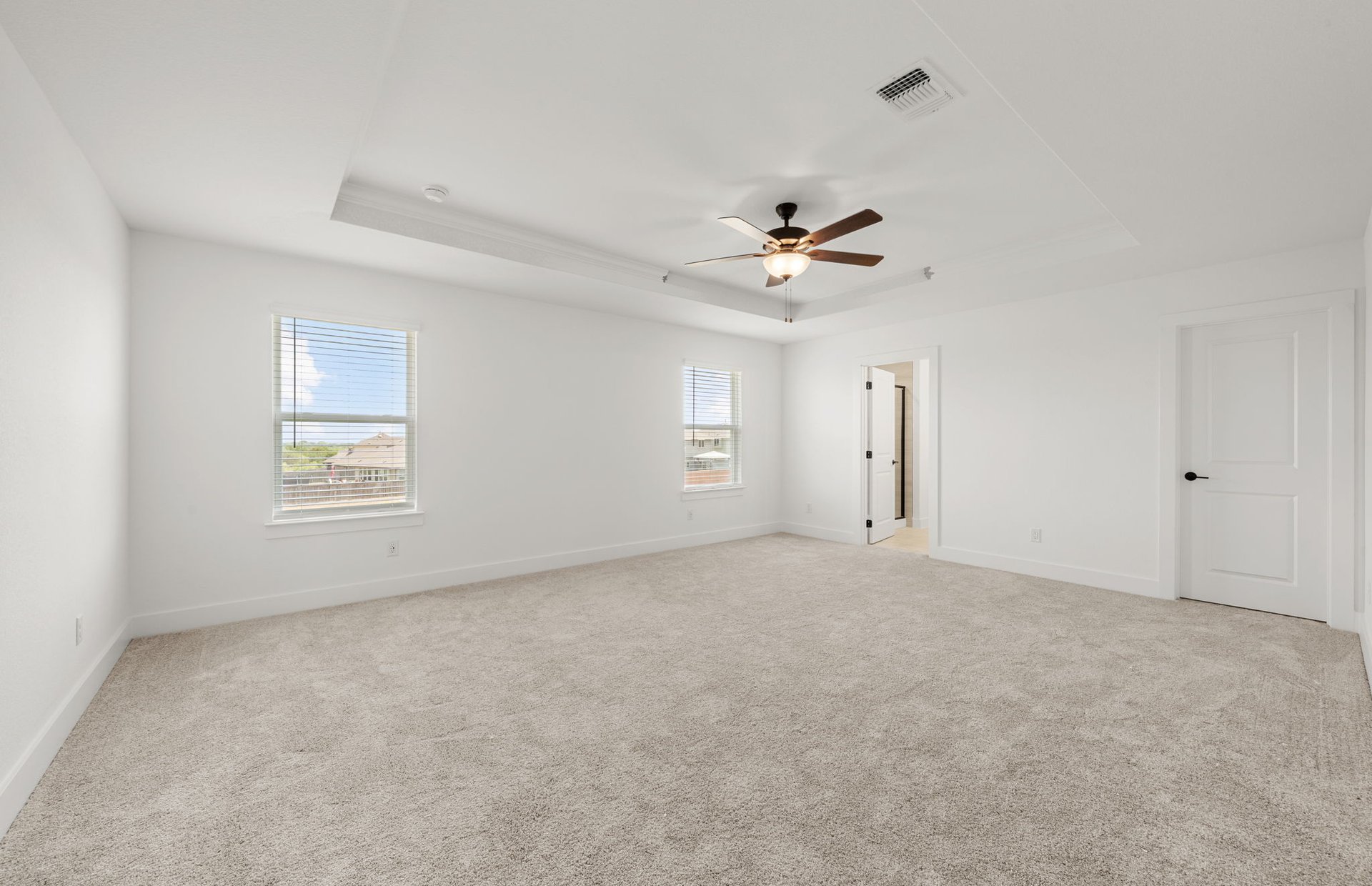 560 Tailwind Drive Kyle, TX 78640 - Photo 27 of 37 a view of an empty room with a ceiling fan