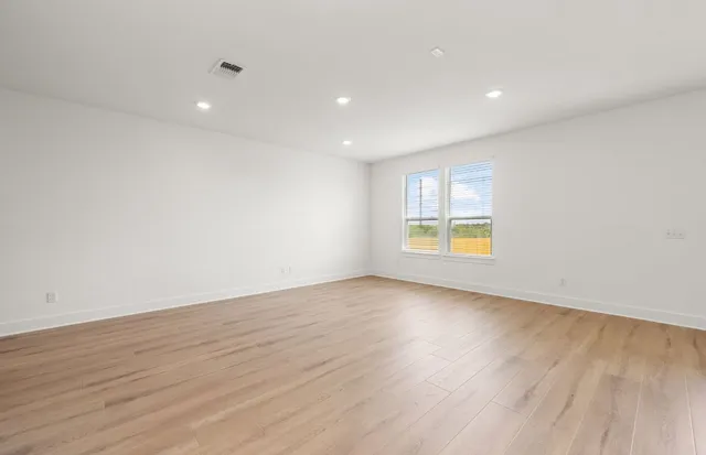 a view of kitchen with a sink and a refrigerator