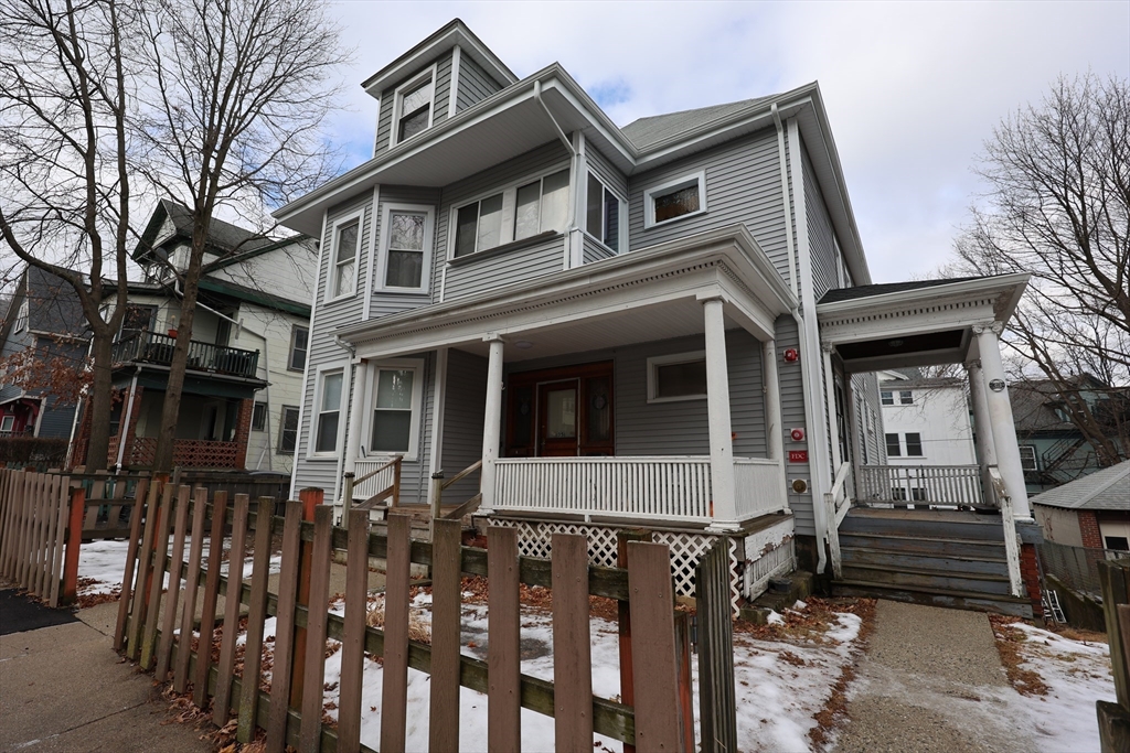 33-35 Ridgemont Street, Unit 3 Boston, MA 02134 - Photo 11 of 12 front view of a house with a small yard