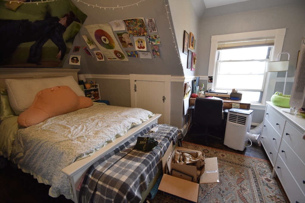 33-35 Ridgemont Street, Unit 3 Boston, MA 02134 - Photo 5 of 12 a bedroom with a bed and furniture