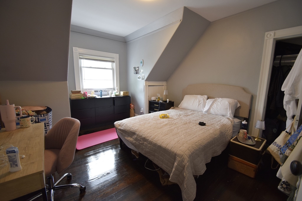 33-35 Ridgemont Street, Unit 3 Boston, MA 02134 - Photo 8 of 12 a bedroom with furniture and a wooden floor