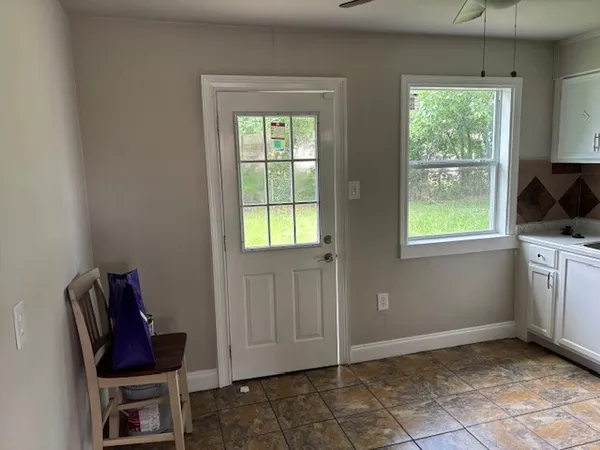 a view of room with window and workspace