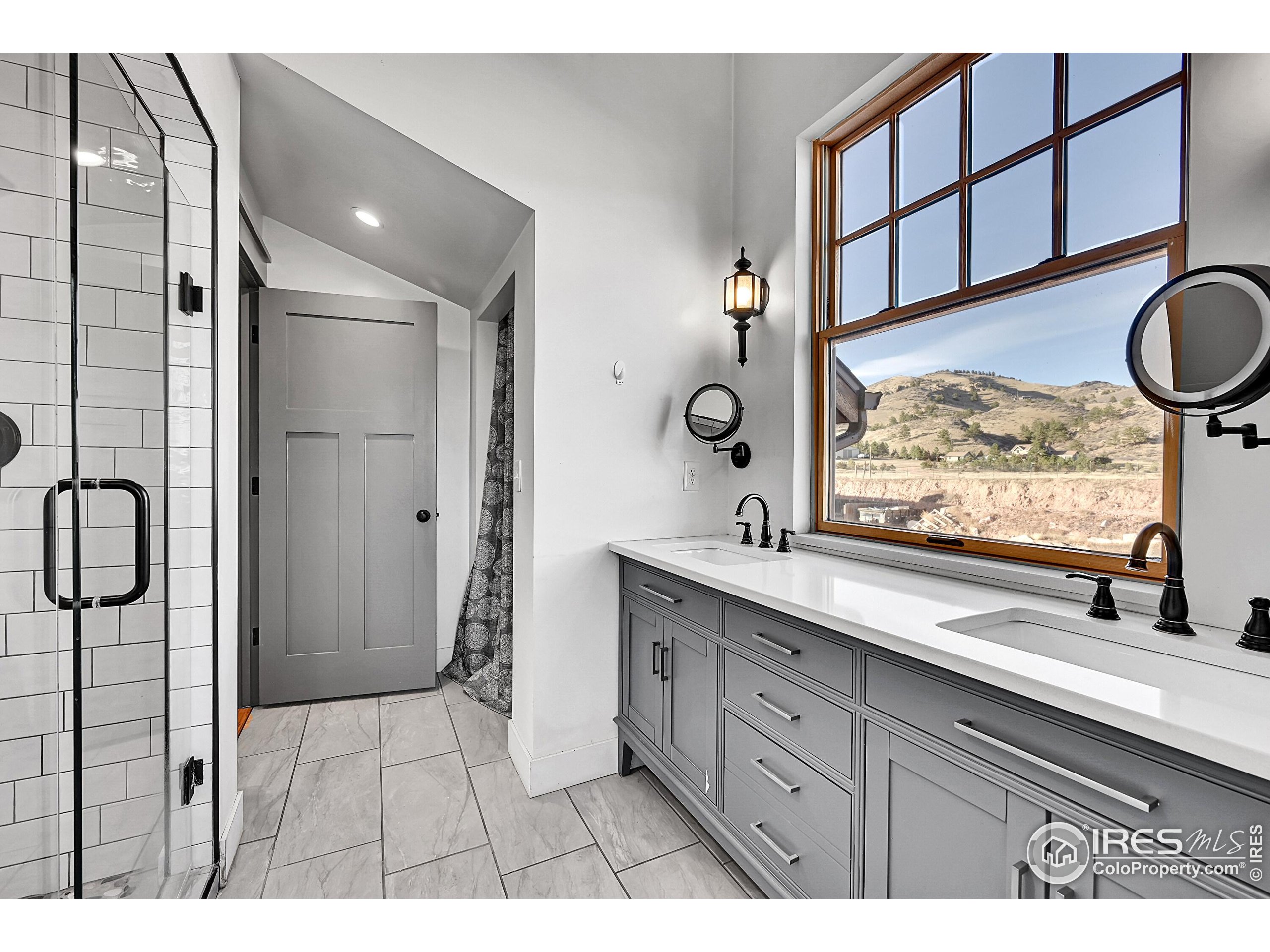 702 Ponderosa Hill Road Lyons, CO 80540 - Photo 23 of 39 a bathroom with a sink and a mirror