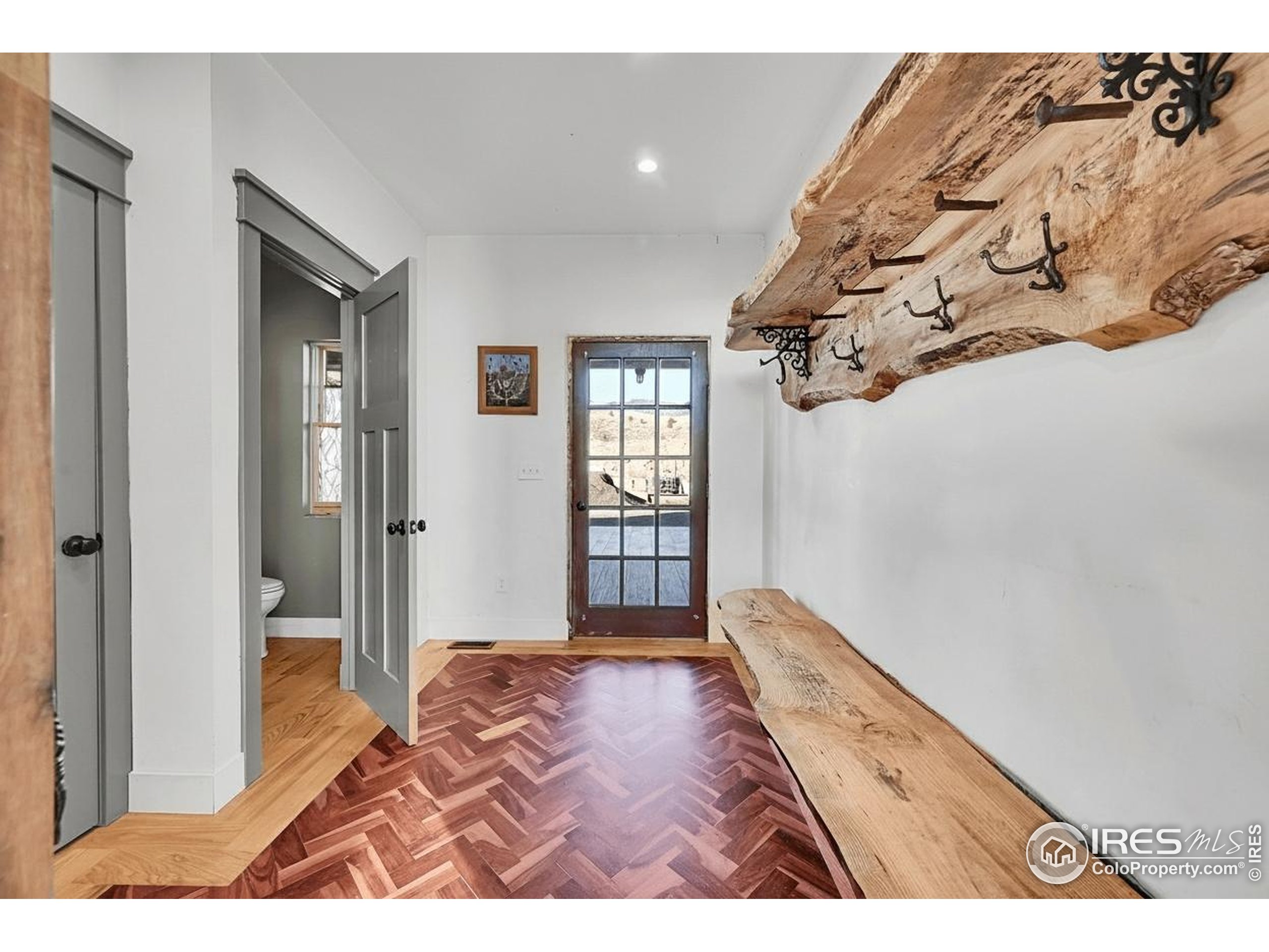 702 Ponderosa Hill Road Lyons, CO 80540 - Photo 4 of 39 a bedroom with a bed and a window
